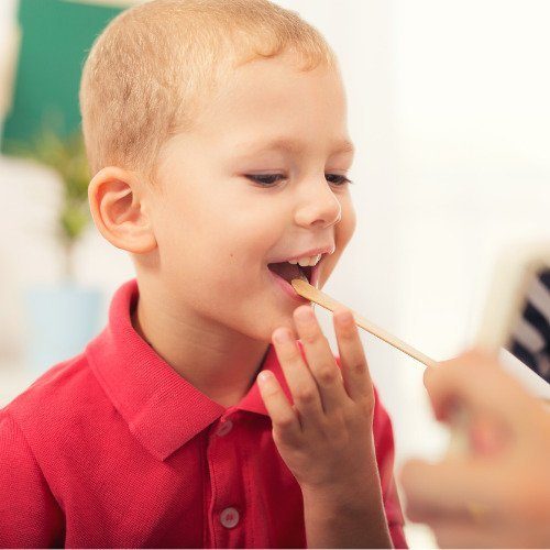 Child receiving oral-motor therapy.